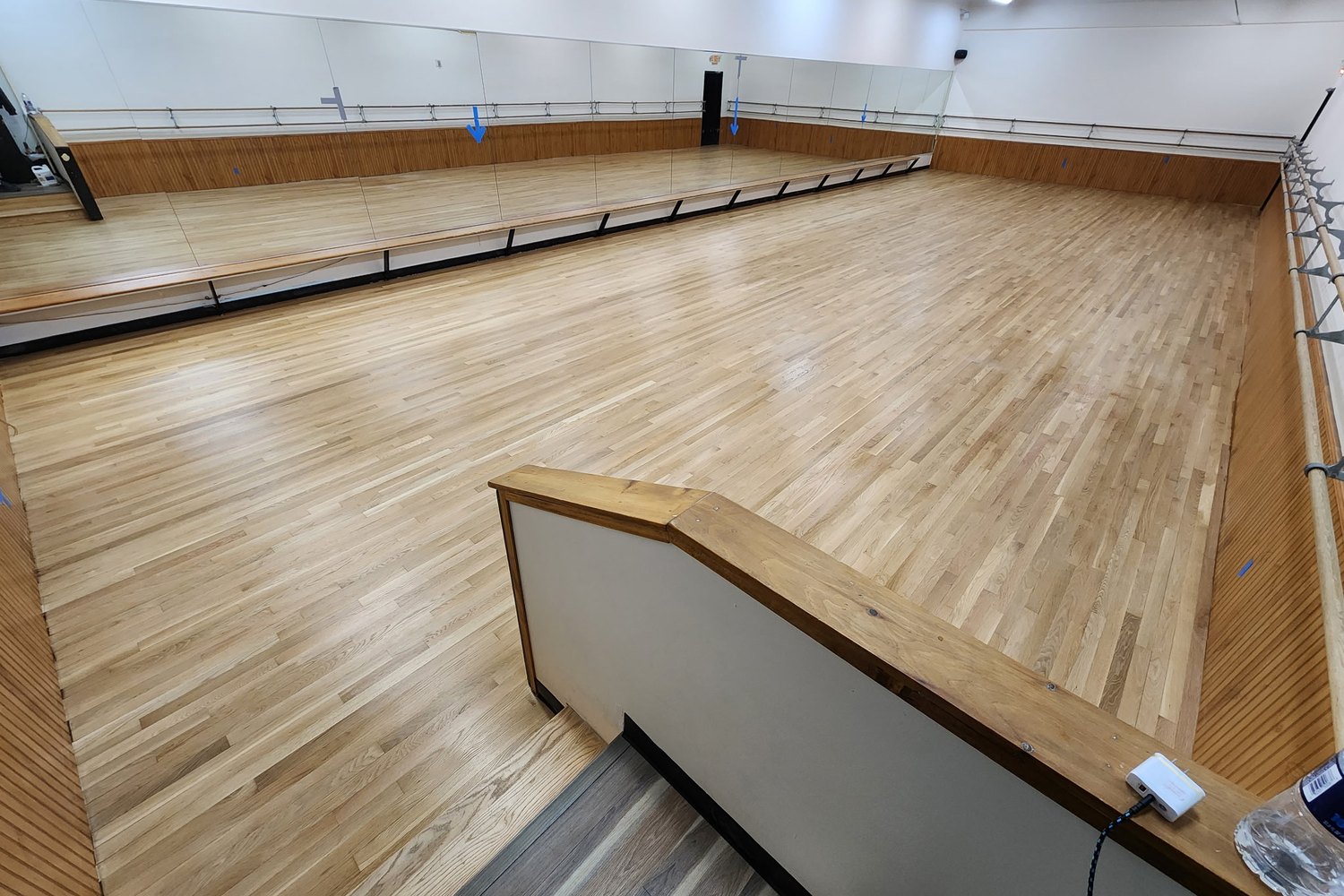 Hardwood floor after refinishing — restored warm wood tones and clean satin sheen